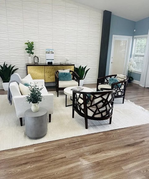 a living room filled with furniture and a rug